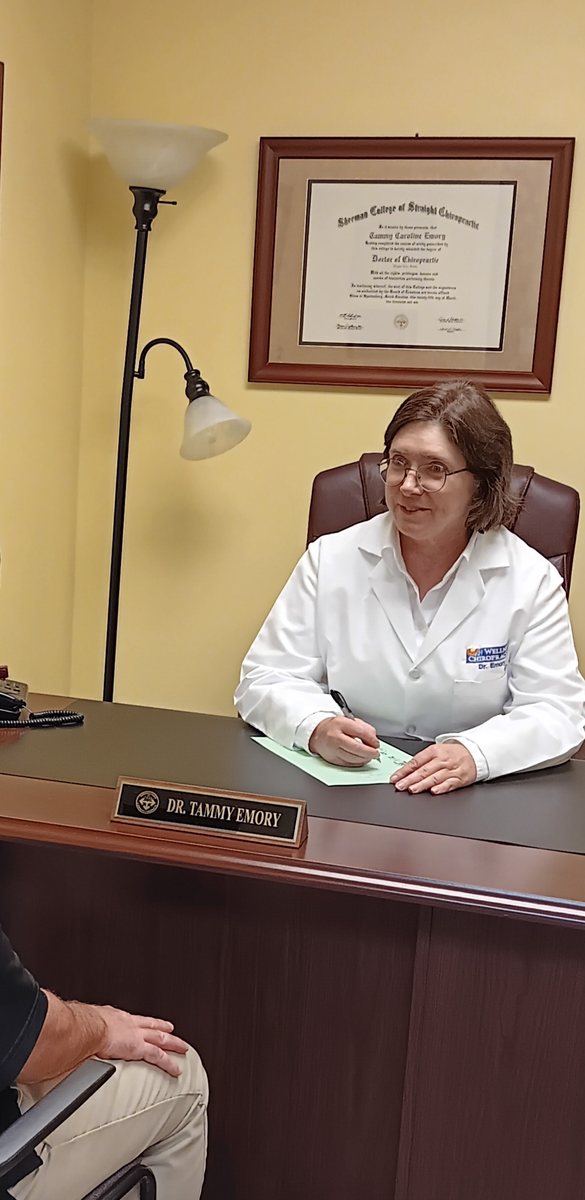 Dr. Tammy Emory at her desk at Wellness Chiropractic Health Center in Duncan, SC